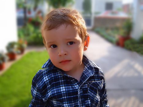 lonely boy is standing in front yard