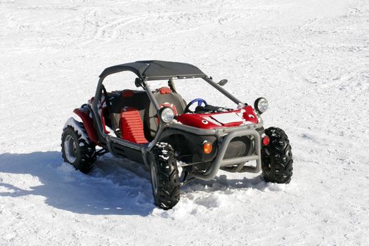 Red ATV on snow