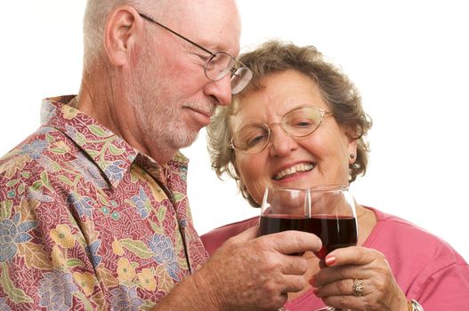 Happy Senior Couple toasting with Winee glasses.