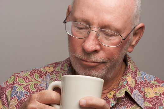 Senior Man Enjoys a Cup of Coffee