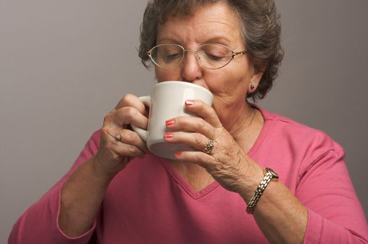Senior Woman Enjoys a Cup of Coffee