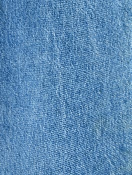 Striped textured used blue jeans denim fabric grunge background