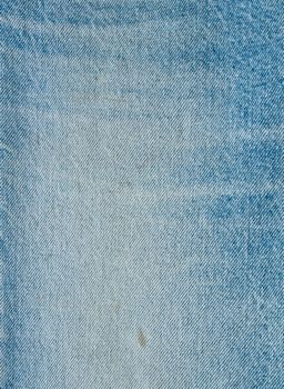 Striped textured used blue jeans denim fabric grunge background