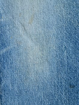 Striped textured used blue jeans denim fabric grunge background