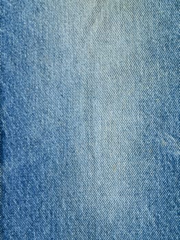 Striped textured used blue jeans denim fabric grunge background