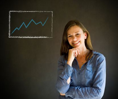 Confident business woman or teacher with arms crossed against a blackboard background