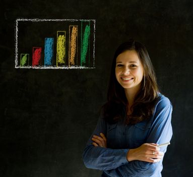 Confident business woman or teacher with arms crossed against a blackboard background