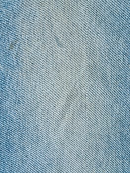 Striped textured used blue jeans denim fabric grunge background