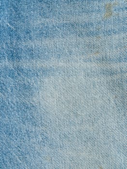 Striped textured used blue jeans denim fabric grunge background