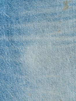 Striped textured used blue jeans denim fabric grunge background