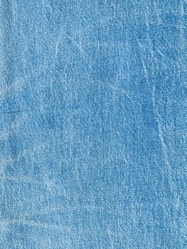 Striped textured used blue jeans denim fabric grunge background