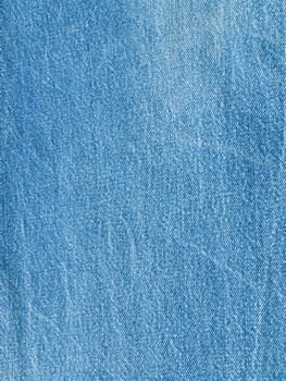 Striped textured used blue jeans denim fabric grunge background