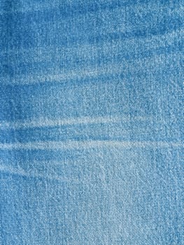 Striped textured used blue jeans denim fabric grunge background