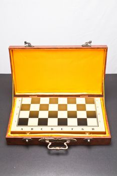 Checker board in  leather box wit yellow lining