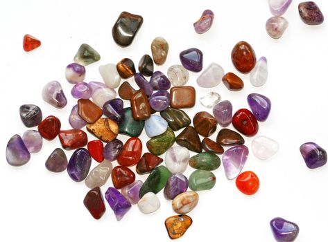 Colorful semiprecious stones on white background
