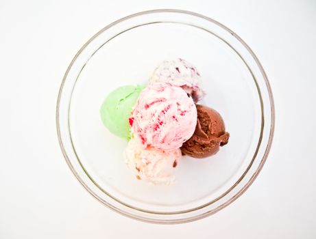 Ice cream in a glass bowl topview isolated on white