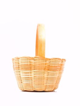 A yellow wicker basket isolated on white background