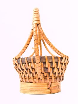 A yellow wicker basket isolated on white background