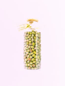 Glass bottle of green beans isolated on white Background.