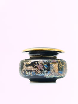 A black miniature ceramic jar painted by tourist destinations in Rome, Italy isolated on white background