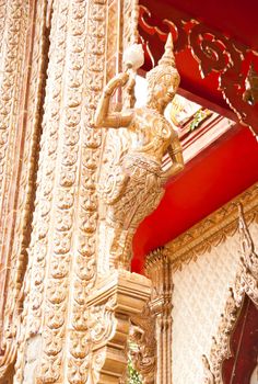 Phetchaburi, Thailand - June 13 : at wat kuti in Phetchaburi Province.
have the wall sculptures of traditional Thai style  and this is a pole of the temple in Thailand. The architecture is beautiful.