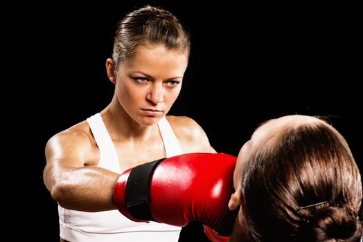 Aggressive boxing woman, hits an opponent in the head