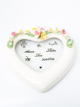 A white ceramic hearth with various language meaning of love