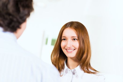 Attractive woman talking with a man, close up portrait