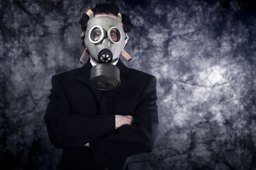 Risk concept, businessman with gas mask and black suit