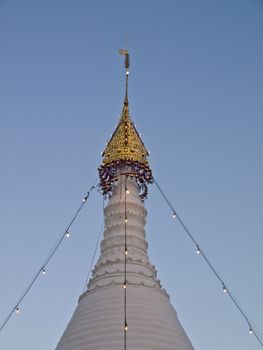 Top of Tai Yai style Pagoda in Wat Phra That Doi Kong Mu temple on a mountain top in Mae Hong Son City in Northern Thailand.