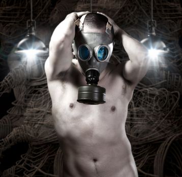 Naked Man with gas mask on background of robots and technology