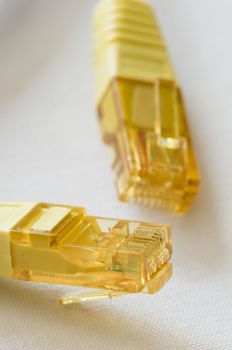 Yellow LAN cable plugs for internet communication