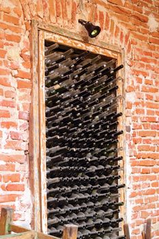 old wine bottles left in a niche on the wall