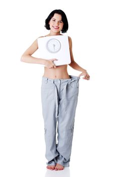 Succesful diet concept - woman with scale.