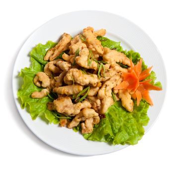 battered chicken on a plate isolated on white