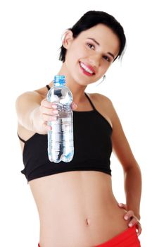 Young fit woman holding bottle of water after fitness exercise