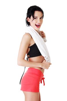 Happy smiling active woman in sports clothes with towel on neck