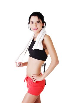 Happy smiling active woman in sports clothes with towel on neck