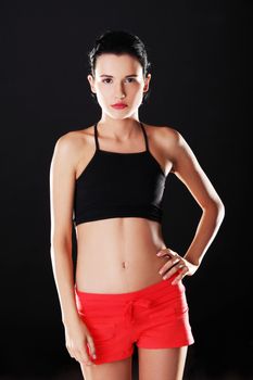 Attractive fitness woman in sport clothes