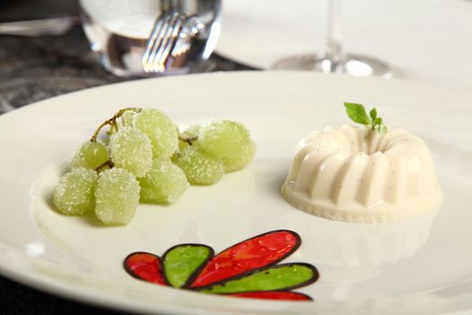 Panna cotta and grapes with sugar