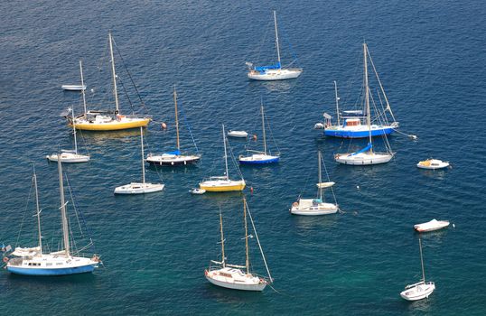 Mediterranean bay with large group of yachts.