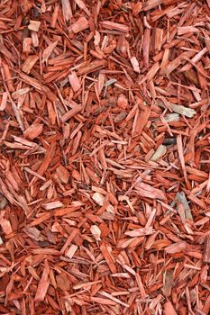 Red woodchips as textured background.