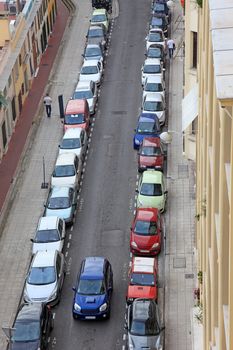 Small street of Nice city with lot od parked cars, France, Europe.