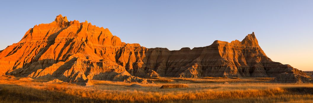 Panorama of prairie and eroded ridge, Badlands National Park, South Dakota, USA