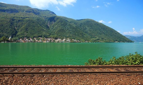 Swiss railroad near lake, Europe.