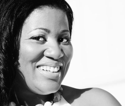 Close-up of an African American woman with a bright smile.