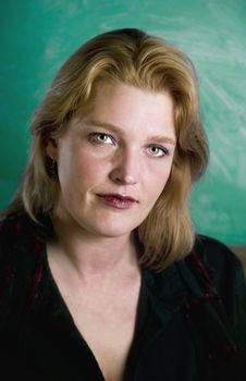 Close up of blonde in a studio setting.