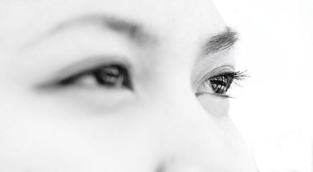 High key tone black and white close up of a beautiful Thai girl with focus on eye