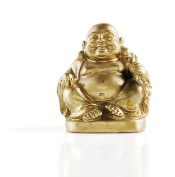 Gold painted laughing buddha figurine isolated against a white background.