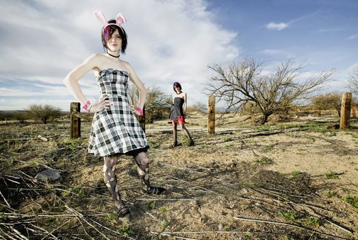 Two punk girls posing in a rural setting